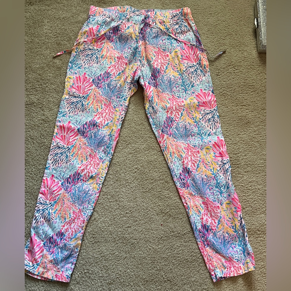 Lilly Pulitzer pants with coral reef pattern.